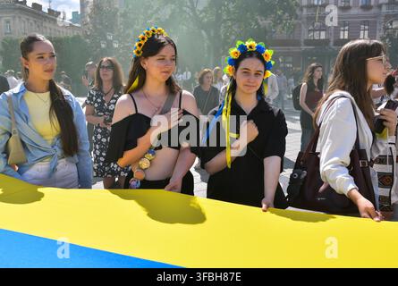 Ukrainians hold national flag a 35-meter long during a public event to mark National Flag Day in Lviv, western Ukraine, 23 August 2026. National Flag Day is celebrated annually in Ukraine on 23 August, honoring one of the country's main state symbols. Stock Photo