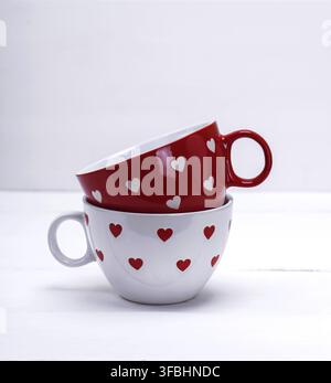 Two empty ceramic mugs for coffee on a white background Stock Photo