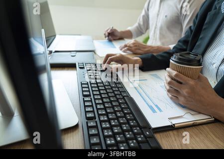 Working business man, team of broker or traders talking about forex on multiple computer screens of stock market invest trading financial graph charts Stock Photo