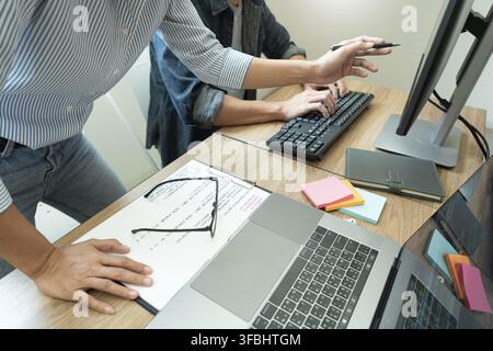 Collaborative work Software engineers website developer technologies or programmer working coding on startup ai application project on screen with par Stock Photo