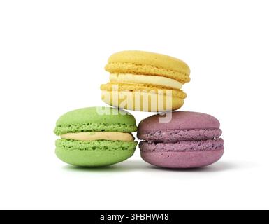 Round baked multi-colored almond flour cakes macarons, dessert is stacked Stock Photo