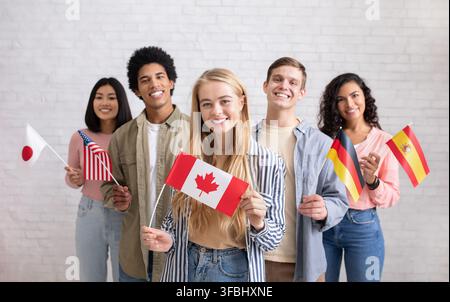 International exchange program and study together. Smiling young multi ethnic students looking at camera Stock Photo