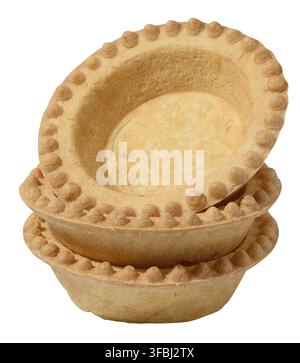 Stack of empty baked round canape baskets isolated on white background, close up Stock Photo
