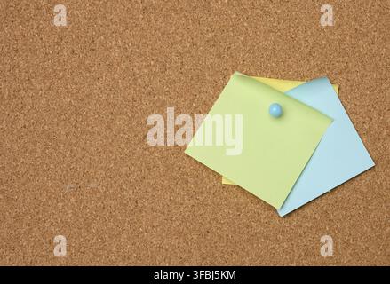 Colorful paper stickers glued on brown board, idea and multitasking, close up Stock Photo