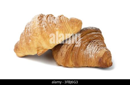 Two baked croissants on a white isolated background, dessert for breakfast sprinkled with powdered sugar Stock Photo
