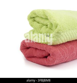 Stack of colored cotton terry folded towels on a white background, copy space Stock Photo