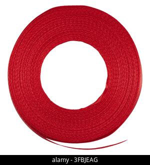 Spool with a red silk ribbon on a white isolated background, an object for decoration Stock Photo