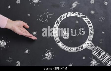The process of finding and fixing bugs in software code Stock Photo