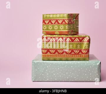 Stack of colored paper wrapped gift boxes. Beautiful box gift, great design for any purposes Stock Photo