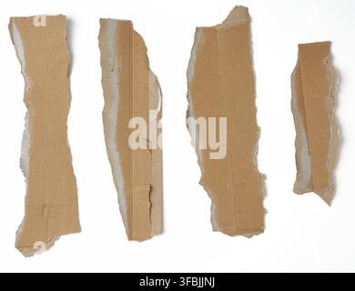 Pieces of cardboard corrugated paper torn edges on a white background, abstract backdrop. Ripped paper texture Stock Photo