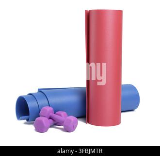 Pair of plastic kg dumbbells and yoga mat isolated on white background Stock Photo