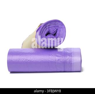 Skein of purple plastic trash bags with strings isolated on white background, close up Stock Photo