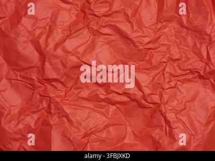 Crumpled red paper sheet, paper texture. Background for designers Stock Photo