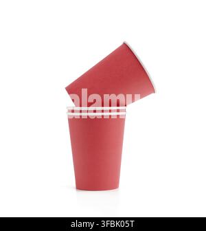 Stack of red paper cups for hot takeaway drinks isolated on a white background. Plastic rejection concept, zero waste Stock Photo