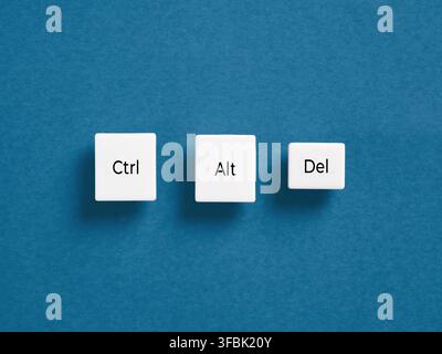 Ctrl Alt Del keyboard keys representing computer reset, restart, or troubleshooting, isolated on a clean blue background Stock Photo