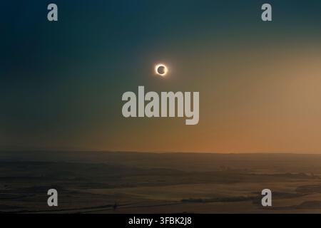 End of totality phase of total solar eclipse with diamond ring effect over the landscape of Alcaniz, Aragon, Spain during the event of August 12, 2026 Stock Photo