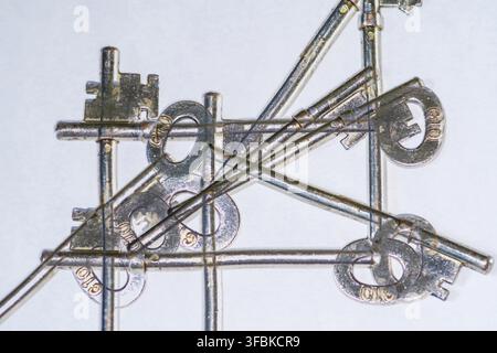 Double exposure keys on a plain white background UK Stock Photo