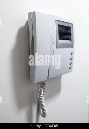 Modern Video Intercom System Mounted on white wall Stock Photo