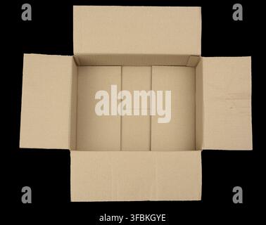 Open empty brown rectangular cardboard box for transporting goods isolated on a black background, top view Stock Photo