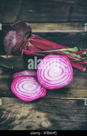 Fresh red beet sliced on brown wooden background Stock Photo