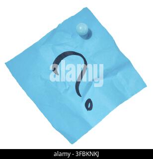 Crumpled sheet of blue paper with a black question mark drawn on it, attached with a blue pushpin, isolated background Stock Photo
