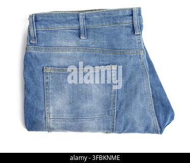 Folded blue men's jeans on a white background, top view Stock Photo