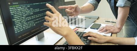 Collaborative work Software engineers website developer technologies or programmer working coding on startup ai application project on screen with par Stock Photo