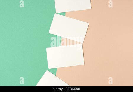 Rectangular white blank business cards on a color background, backdrop for the designer Stock Photo