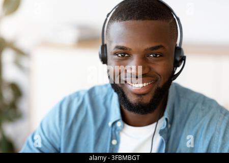 Hotline Support Service. Portrait Of Smiling African Customer Service Operator In Headset Stock Photo