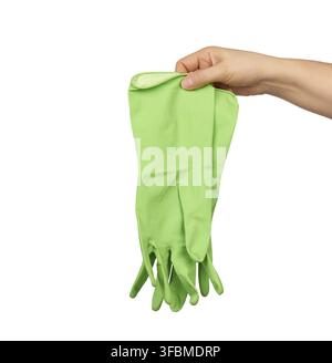 Female hand holds green rubber gloves for cleaning, white background Stock Photo