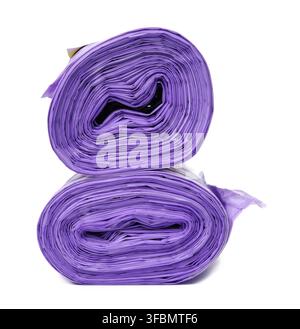 Skein of purple plastic trash bags with strings isolated on white background, close up Stock Photo
