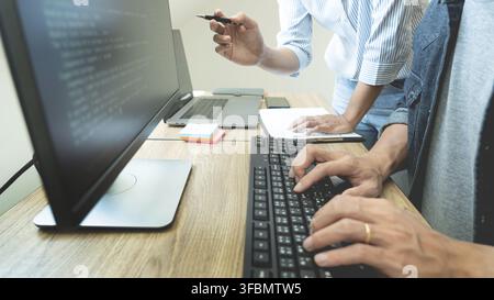 Collaborative work Software engineers website developer technologies or programmer working coding on startup ai application project on screen with par Stock Photo