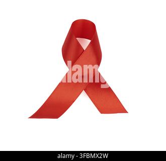 Red silk ribbon folded into a loop and isolated on a white background. symbol of the fight against disease AIDS and vasculitis, close up Stock Photo