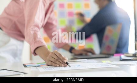Graphic designers team work together with UX UI designer planning application template layout mobile phone prototype, User experience concept Stock Photo