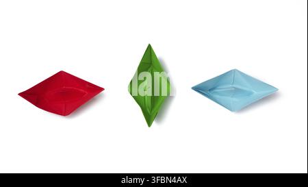 Three paper boats on a white background, top view Stock Photo