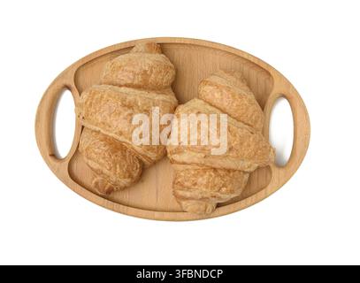 Two baked croissants lie on a wooden tray, food isolated on white background, top view Stock Photo