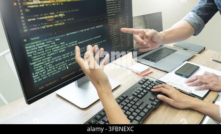 Team of programmers working together development Website design and coding technologies in a software develop company office, Coworkers Team concept Stock Photo