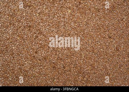 Texture of dry brown flax seeds, top view, full frame Stock Photo