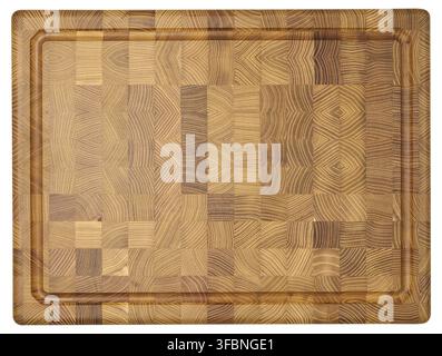 Top down view of a rectangular wooden cutting board made of end grain construction, showcasing a mosaic of wood patterns and a carved juice groove aro Stock Photo