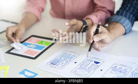Team User experience (UX) designer creative graphic planning or designing application development a prototype for mobile phone or smartphone layout Stock Photo