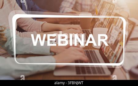 Webinar text over programmers working in software developing company Stock Photo