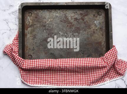 Empty rectangular iron baking sheet on white marble table, top view Stock Photo
