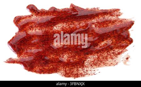 Spilled red nail polish with sparkles on a white background, blot Stock Photo