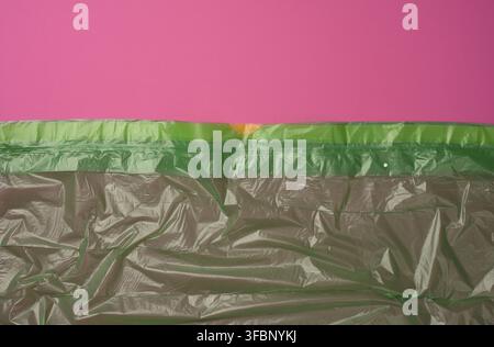 Crumpled green polyethylene texture, close up, full frame Stock Photo