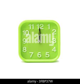 Square green clock with white numbers isolated on white background, close up Stock Photo