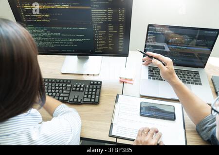 Team of programmers working together development Website design and coding technologies in a software develop company office, Coworkers Team concept Stock Photo
