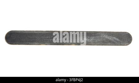 Used black nail file isolated on white background, close up Stock Photo