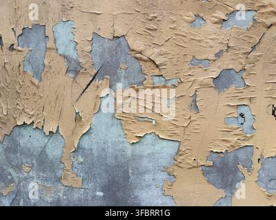 Old concrete house wall with peeling paint Stock Photo