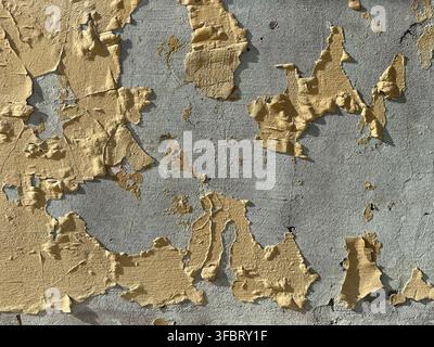 Old concrete house wall with peeling paint Stock Photo