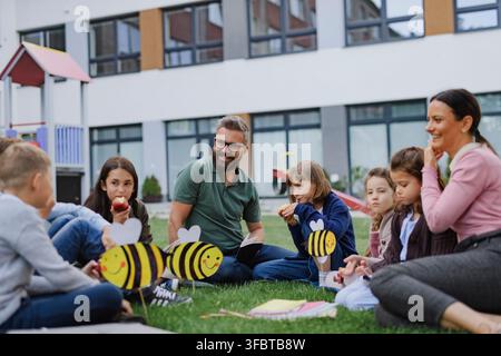 Students exploring ecology and biodiversity during outdoor class at school. Stock Photo